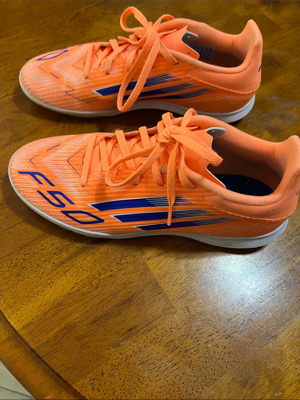 Orange Adidas Shoes with Blue Accents